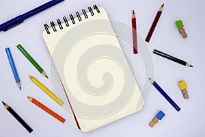 Blank page of sketching pad with pencil on white, top view photo. Kids art class or artistic hobby banner background.