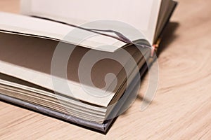 Blank pages in an open notepad close-up