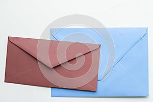 Blank paper envelopes on marble flatlay background, holiday mail letter or post card message design