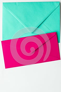 Blank paper envelopes on marble flatlay background, holiday mail letter or post card message design