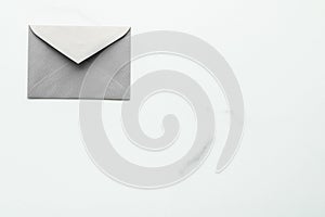 Blank paper envelopes on marble flatlay background, holiday mail letter or post card message design