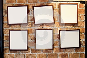 Blank paper frames hanging on wall