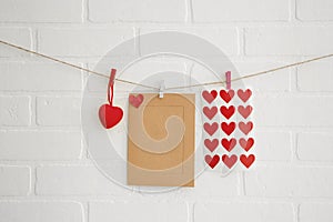 Blank paper frames on white brick wall