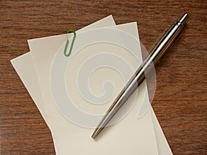 Blank paper note and pen (note space)