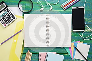 blank paper note with pencil and business objects and accessories on wood background.