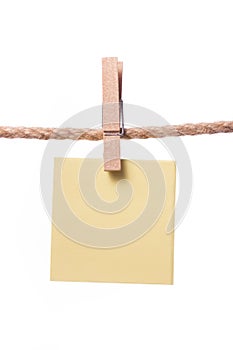 Blank paper notes hanging on rope with clothes pins, copy space