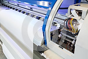 Blank paper roll and ink circuits in large printer format inkjet machine for industrial business