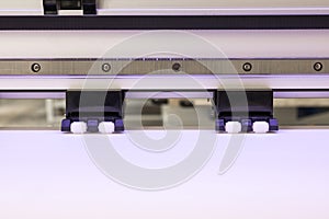 Blank paper roll and wheel in large printer format inkjet machine for industrial business