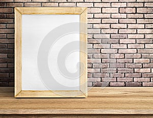 Blank paper white board on wooden table at red brick wall,Template mock up for adding your design and leave space beside frame