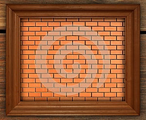 Blank photo frame on old brick wall