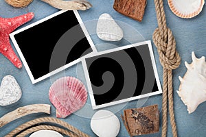 Blank photo frames with seashells, ship rope, sea stones