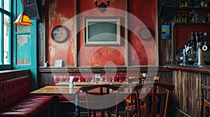 A blank picture frame hanging on the old textured wooden wall in a cosy old english or irish pub.