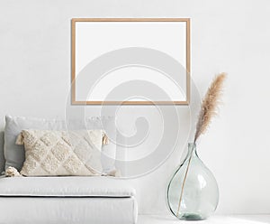 Blank picture frame mockup on white wall, horizontal artwork template.