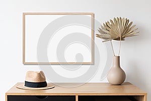 Blank picture frame mockup on white wall horizontal template. Artwork in minimal interior design.