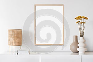 Blank picture frame mockup on white wall in minimal modern interior design.