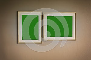 Blank picture green screen wooden frame on the wall