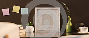 Blank picture photo frame mockup with home accessories over brown wall