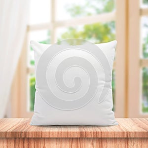 Blank pillows made from soft feather on morning window and curtains background with bedding concept. White pillow template place