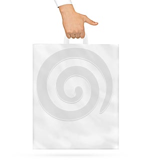 Blank plastic bag mock up holding in hand. Empty polyethylene pa