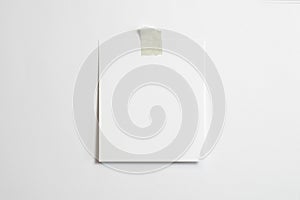 Blank polaroid photo frame with soft shadows  and scotch tape isolated on white paper background as template for graphic designers