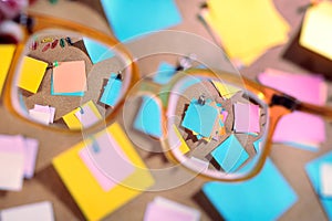 Blank post-its seen through high diopter eyeglasses.