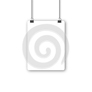 Blank poster hanging on a binder clips. A4 white paper sheet hangs on a rope with clips.