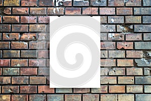 Blank poster hangs in front of urban brick street wall mockup