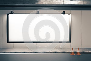 Blank poster on wall and traffic cone