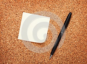 Blank postit note on cork notice board