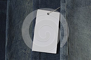 Blank price tag, clothes label mock up on jeans denim cloth