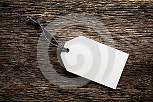 Blank price tag label on wooden background