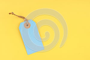 Blank price tag on yellow background