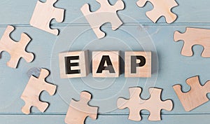 Blank puzzles and wooden cubes with the text EAP Employee Assistance Program