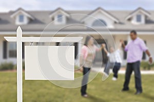 Blank Real Estate Sign and Hispanic Family in Front of House