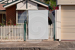 Blank real estate sign outside an suburban residential property