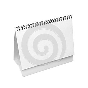 Blank real paper desk calendar isolated on white