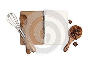 Blank recipe book, anise stars and kitchen utensils on white background, top view. Space for text