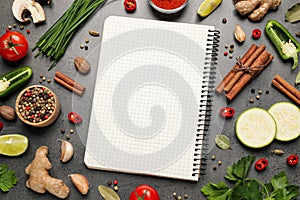 Blank recipe book and different ingredients on grey table, flat lay. Space for text