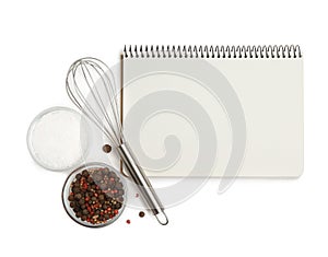 Blank recipe book, spices and whisk on white background, top view. Space for text