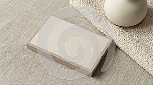 Blank rectangular box mockup on fabric surface