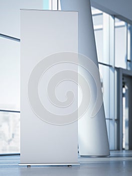 Blank roll up banner at the modern office. 3d rendering