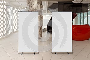 Blank roll up banner stand in contemorary office interior