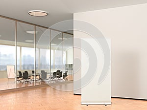 Blank roll up banner stand in modern office