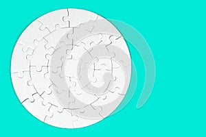 Blank Round Jigsaw Puzzle Isolated on Turquoise Background