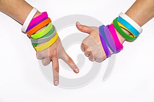 Blank rubber wristbands on wrist arm. Silicone fashion round social bracelet wear hand. Unity band.