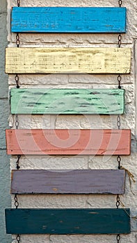 Blank rustic sign hanging on chains