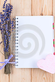 blank sheet of notebook for the inscription and a bunch of lavender flowers