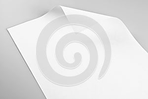 Blank sheet of paper with curled corner