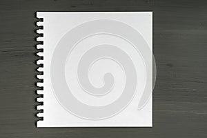 Blank sheet of paper on wooden background