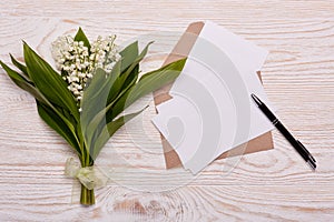 Blank sheets with envelope and flowers.